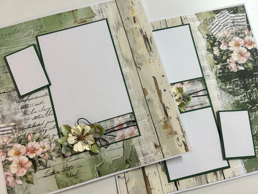 Scrapbooking pages with floral and rustic design elements on a wooden surface.